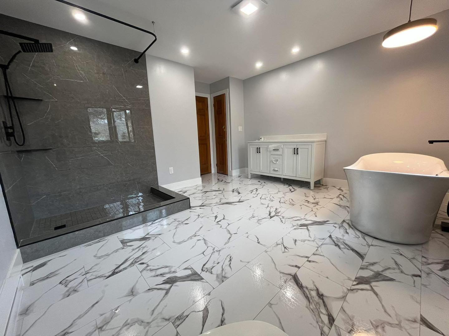 Modern residential bathroom renovation with updated fixtures and tile work